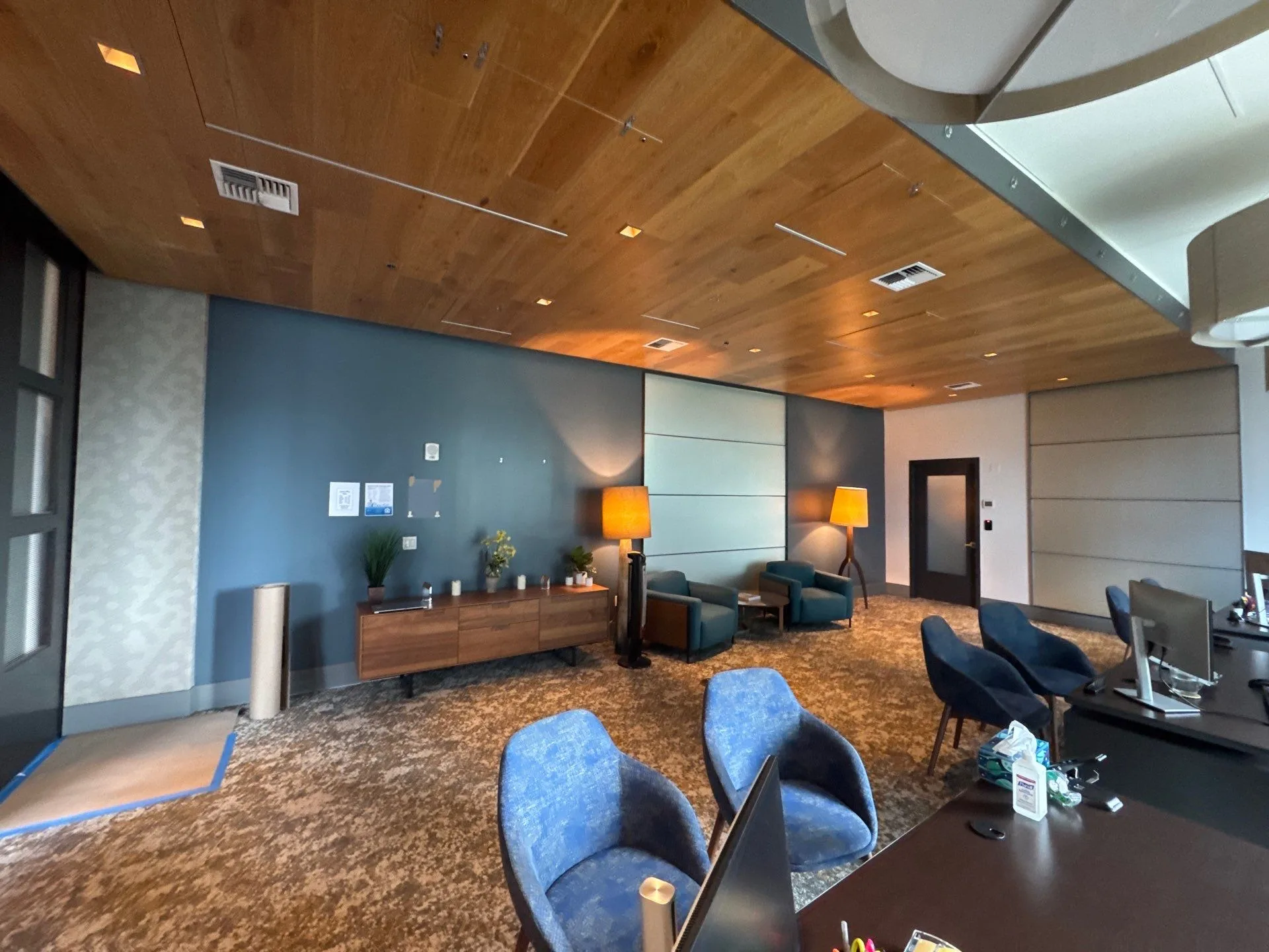 Corporate office lounge with accent wall painting