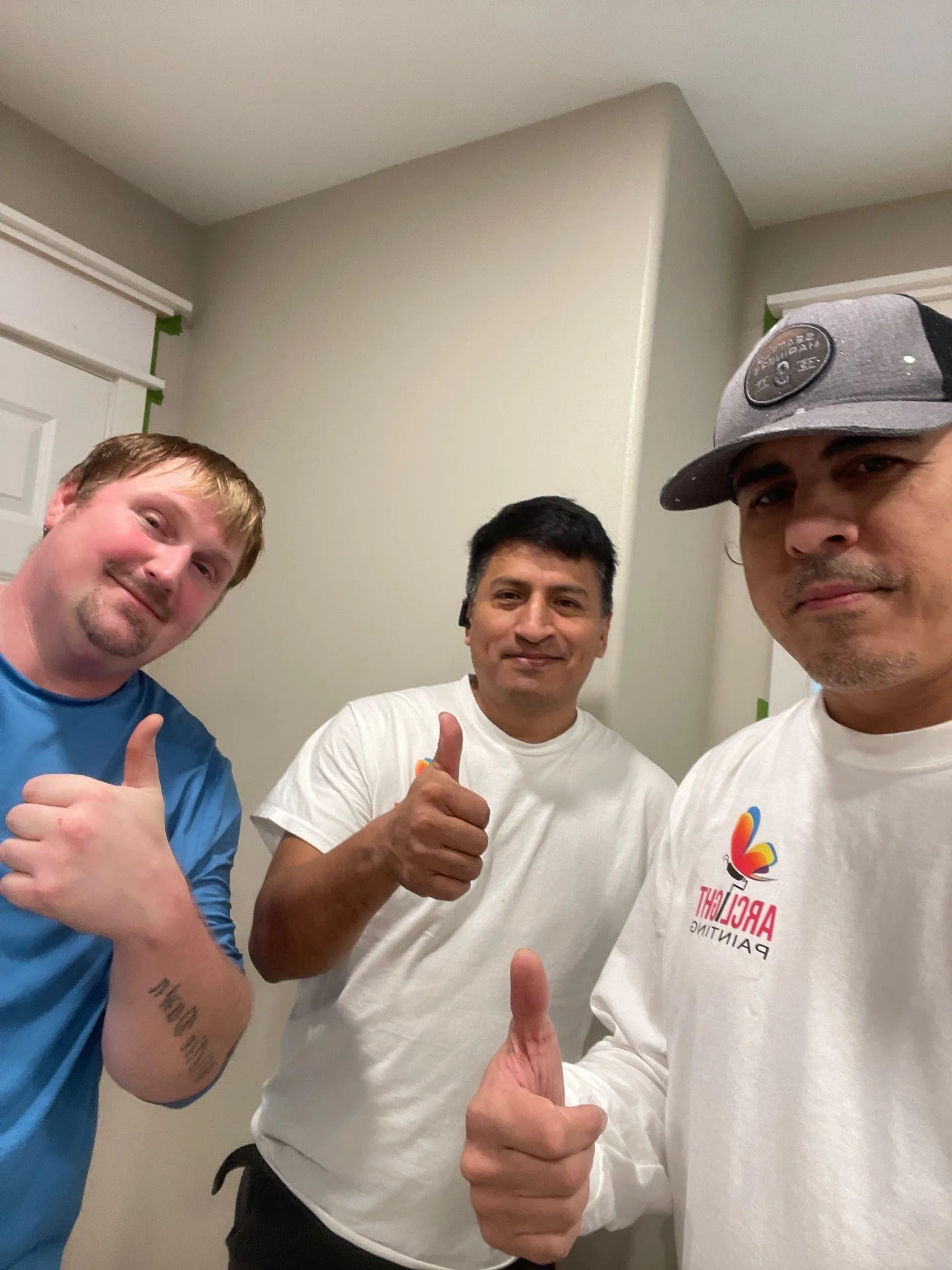 Arclight Painting team giving thumbs up after completing project